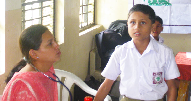 Clinical health check-up of slum/rural area school students