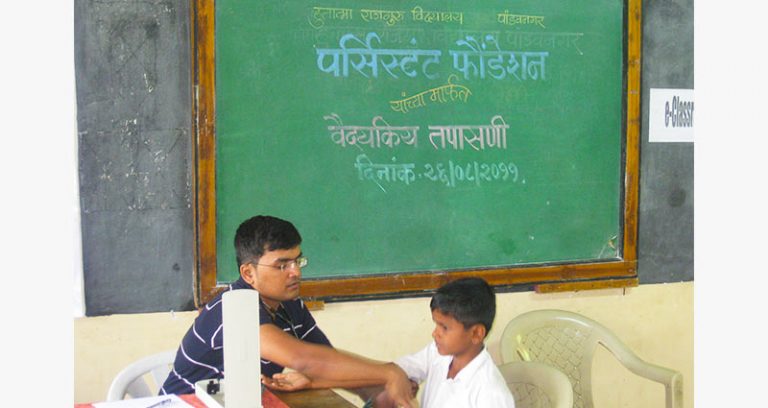 Clinical health check-up of slum/rural area school students